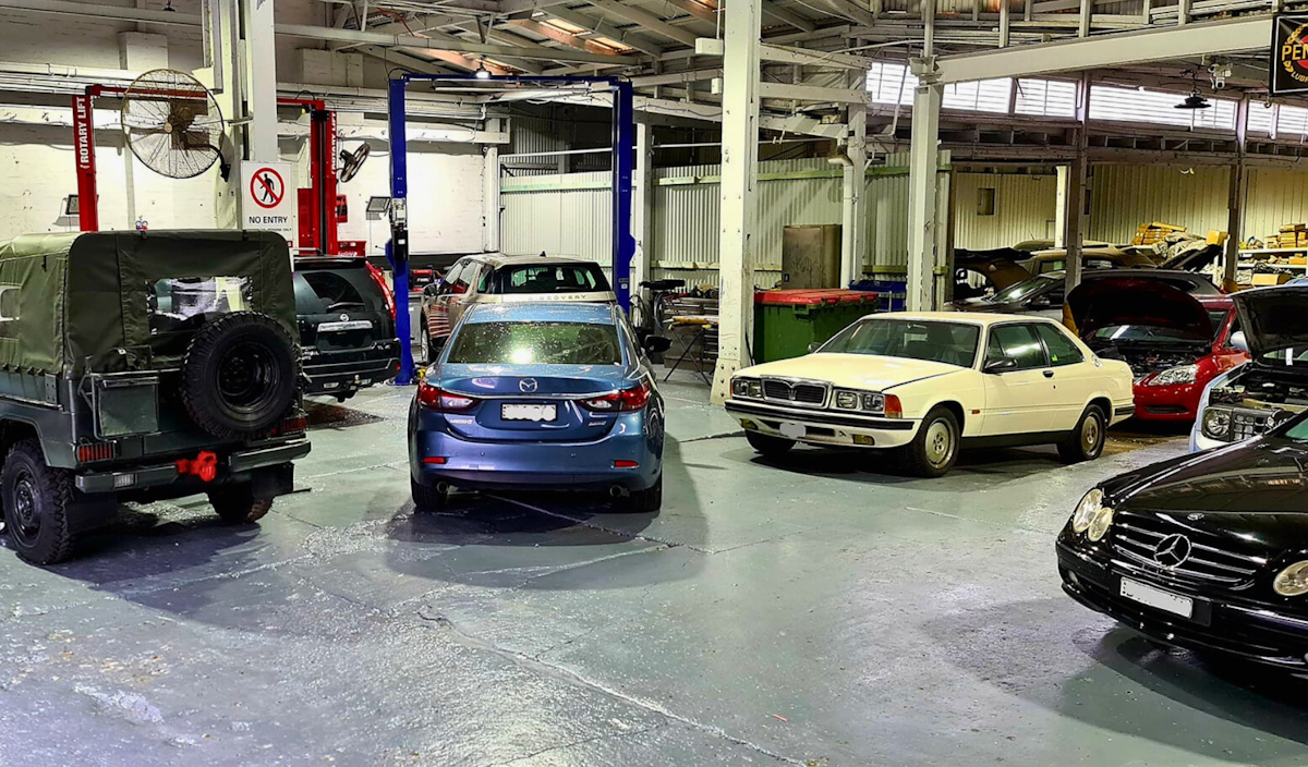 A-Z Auto workshop interior with cars in for service